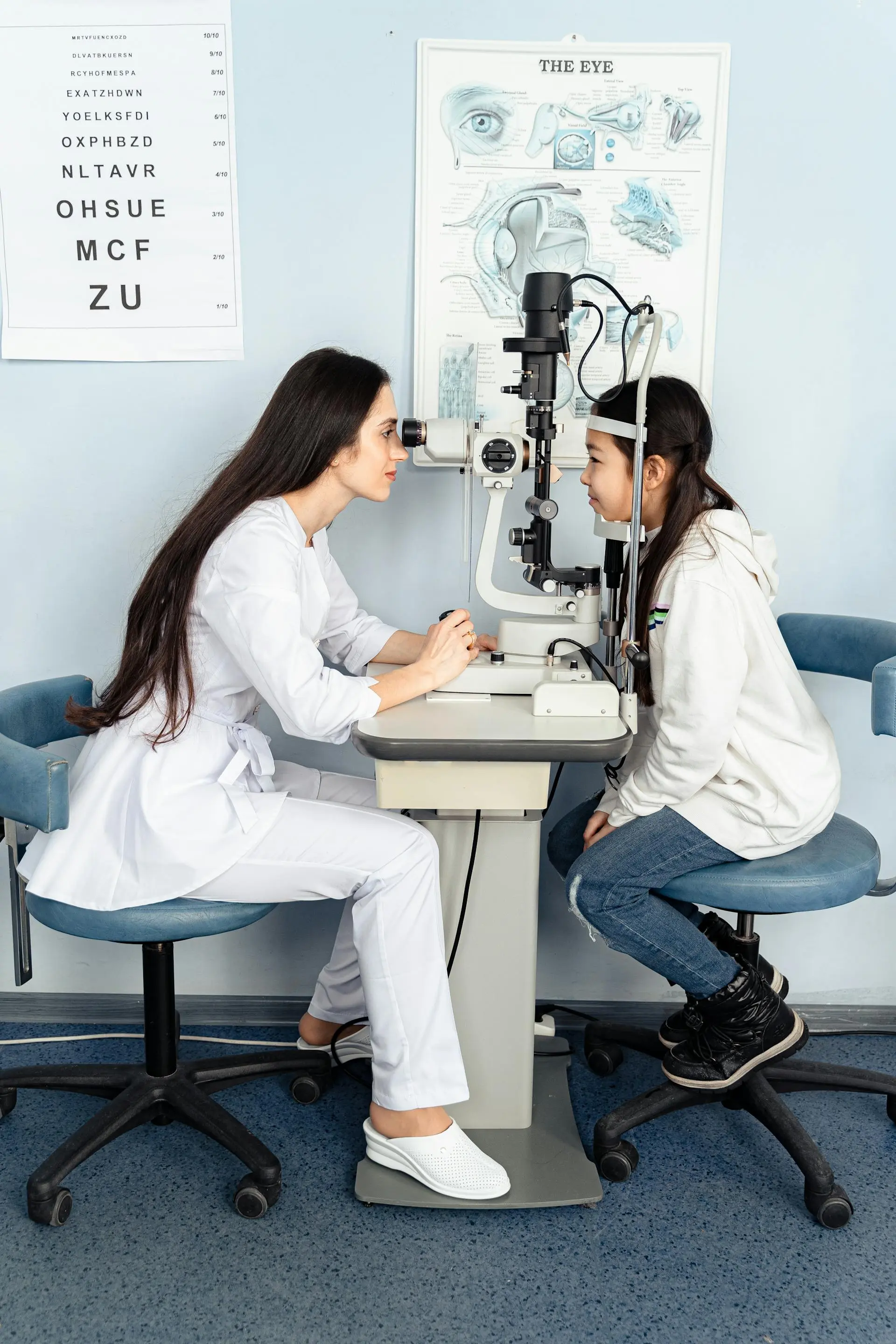 Professional optometrist helping patient select glasses